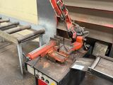 an image of a machine that is working on a piece of metal