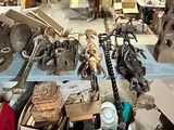 many different types of weapons on display in a store