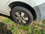 a car that has a flat tire on the side of the road