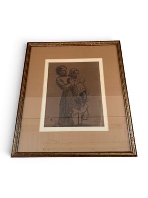 framed drawing of a woman holding a child in her arms