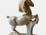 statue of a man riding a horse on a stone base