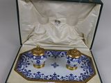 an image of a blue and white tray with two candles in it