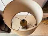a lamp that is sitting on a table in a room