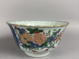 an image of a blue and white bowl with flowers on it
