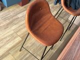 two chairs that are sitting on a wooden floor