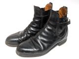 black leather ankle boots with buckles on each side