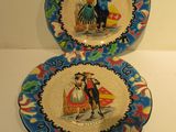 two plates with a picture of a man and a woman on them