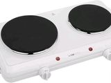an image of a white electric stove top with two burners on it