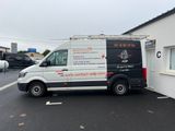 an image of a van parked in front of a building