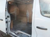 a white van with the door open and a man standing in the back of it