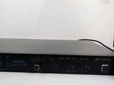 an image of a black amplifier sitting on top of a white table