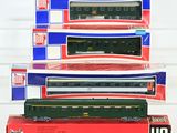 three boxed train cars are stacked on top of each other