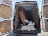 boxes in the back of a van with the door open