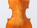 an old violin with a wooden back and bow on a white background