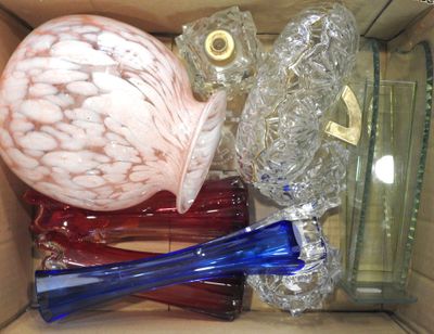 a box full of glass vases and other glass items