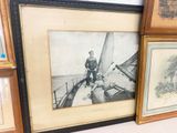 a picture of a man standing on a boat in the water