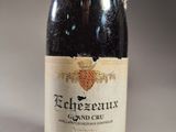 an old bottle of wine sitting on top of a table