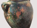 a large vase with a handle on a white background