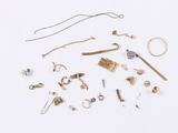 many different types of jewelry on a white surface
