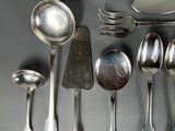 many spoons, forks, and spoon spoons on the table