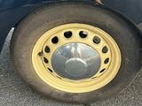 a close up of a tire on a car with graffiti on it