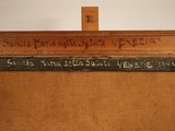 an old wooden easel with writing on it in a room