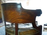 a chair that is sitting in the middle of a room