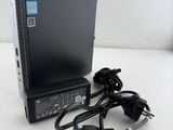 a close up of a laptop computer with a power cord attached to it