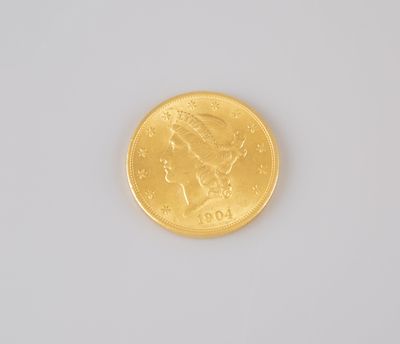 an image of a close up of a gold coin on a white surface