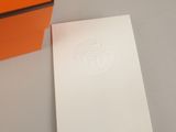 an orange box with a white logo on it next to an orange box