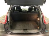the back of a car with the trunk open and the seats down