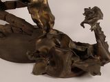 a bronze statue of a man riding a horse on top of a horse