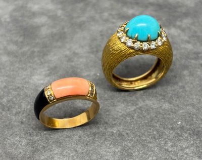 two gold rings with turquoise and coral stones on them