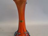 a glass vase that is sitting on a table