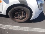 a white car that is parked in a parking lot