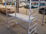 scaffolding in a warehouse with a lot of wood and metal