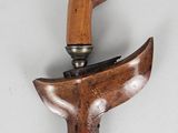 a close up of a cane with a wooden handle