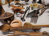 many different types of wooden spoons and utensils on a table