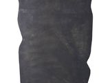 a black stone sculpture on a black stand with a white background