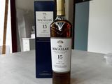 the bottle of macallan 15 years old is sitting on the counter