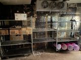 a room that has a bunch of shelves in it