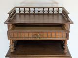a small wooden table with a drawer on top of it