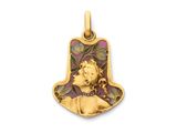 un pendentif en or orné d'un visage de femme et de feuilles