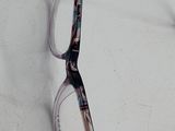 a pair of glasses sitting on a white surface