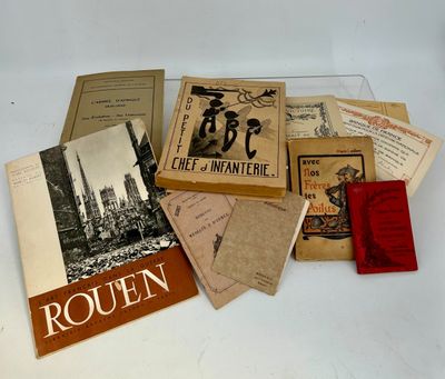 many books on a white table with a red book