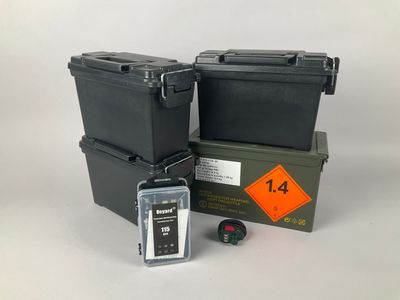 two black boxes and a green box with a yellow tag on it