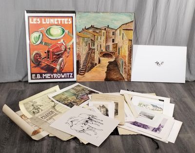 a lot of old postcards on the floor next to a laptop