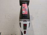 an image of a vacuum cleaner that is on the floor