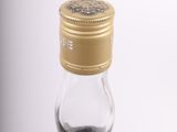 an image of a bottle of whisky sitting on top of a table