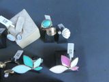 a lot of rings that are sitting on a table